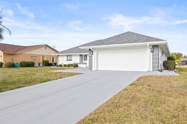 ranch-style home featuring a garage and a front lawn