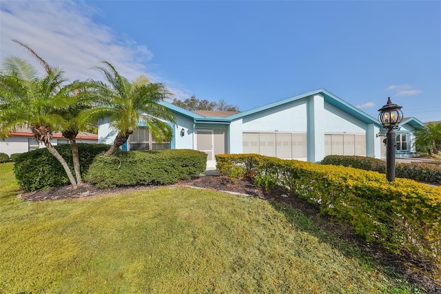 view of front of home with a front lawn