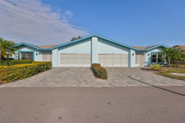 ranch-style home with a garage