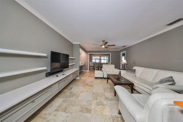 living room with ceiling fan and ornamental molding