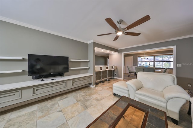 living room featuring crown molding and ceiling fan with notable chandelier