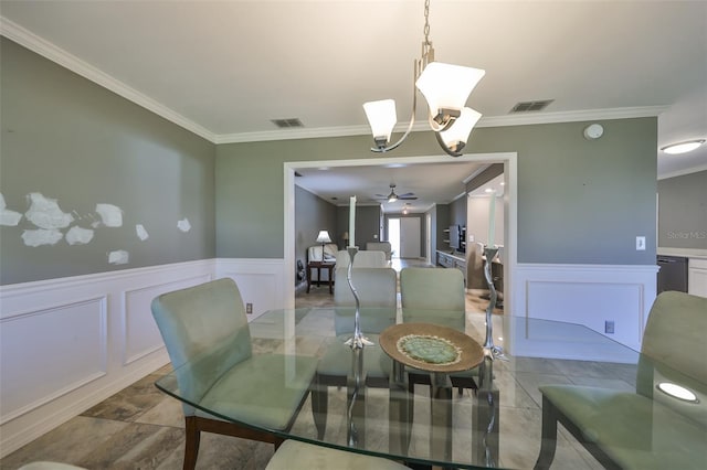 dining room with ceiling fan with notable chandelier and crown molding