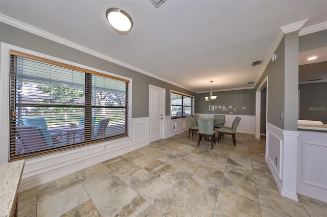 unfurnished dining area featuring ornamental molding and a notable chandelier