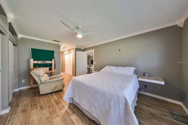 bedroom with ceiling fan, light hardwood / wood-style floors, and ornamental molding