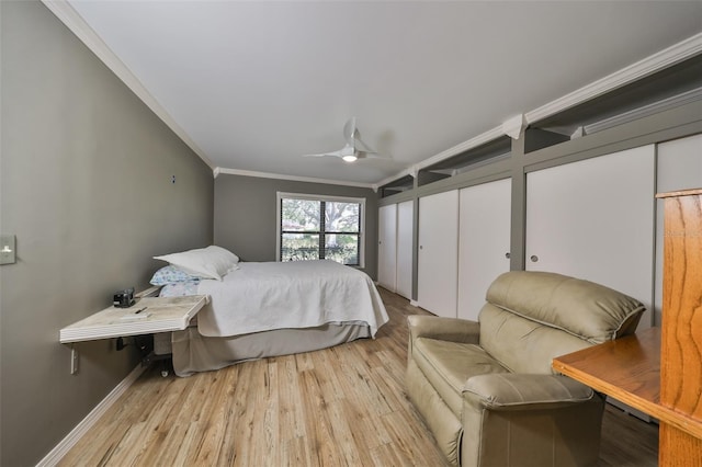 bedroom with ceiling fan, crown molding, and light wood-type flooring