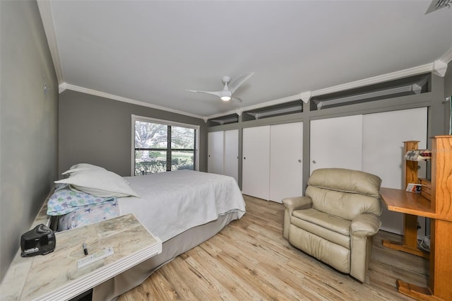 bedroom with light hardwood / wood-style flooring, ceiling fan, and crown molding