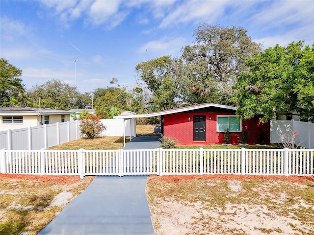 ranch-style house featuring a carport