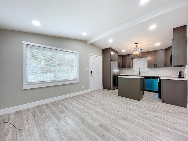 kitchen with a center island, hanging light fixtures, stainless steel fridge, dishwashing machine, and light wood-type flooring