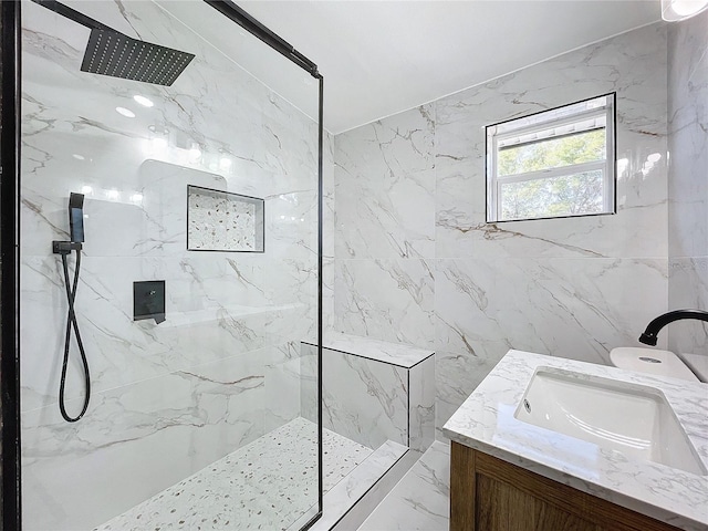 bathroom with vanity and a tile shower