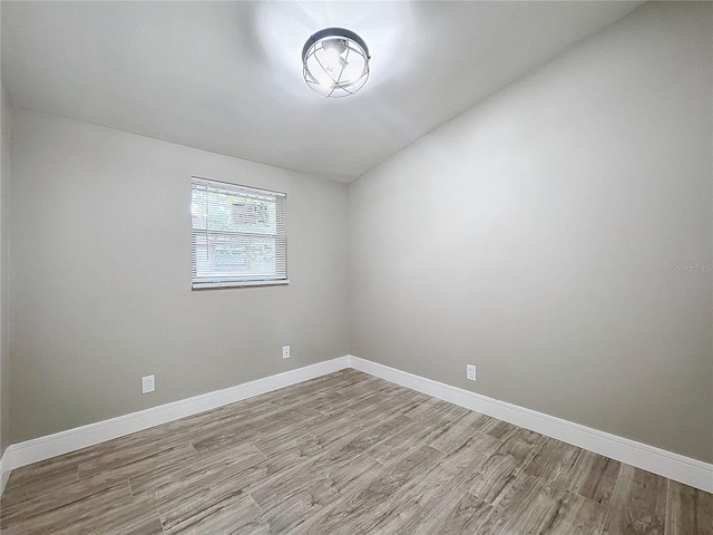 unfurnished room featuring light hardwood / wood-style floors