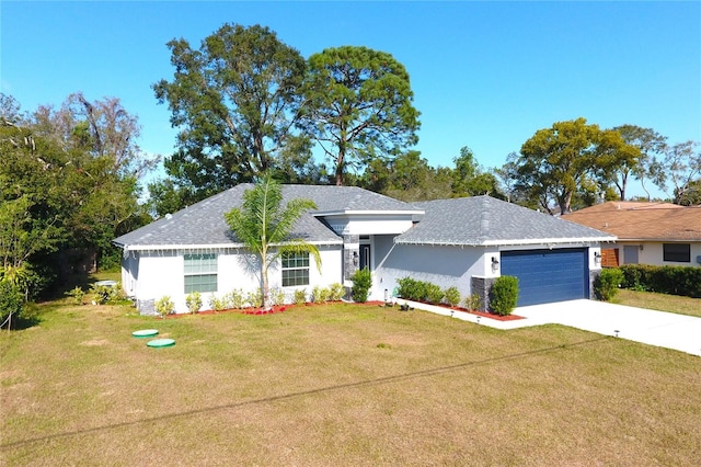 view of front of property featuring a garage and a front lawn