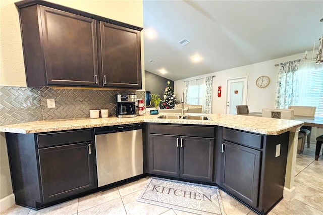 kitchen featuring kitchen peninsula, tasteful backsplash, stainless steel dishwasher, dark brown cabinetry, and sink