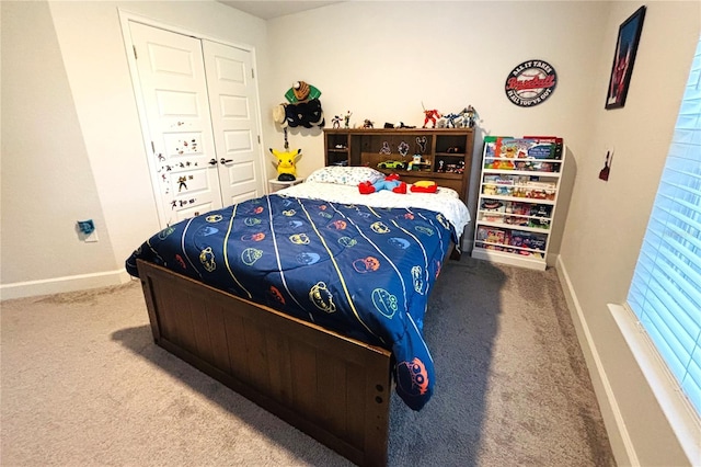 bedroom with carpet and a closet