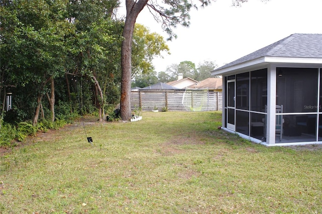 view of yard featuring a sunroom