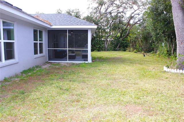 view of yard with a sunroom