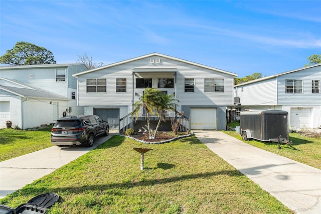 view of front of home featuring a garage and a front yard