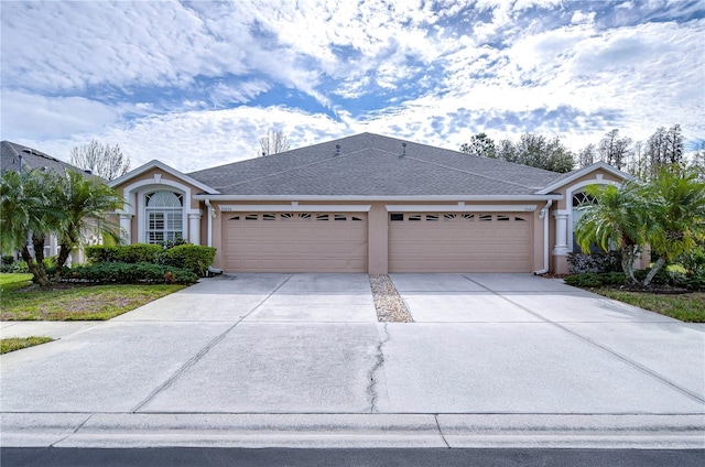 single story home featuring a garage