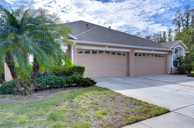 view of side of property with a garage