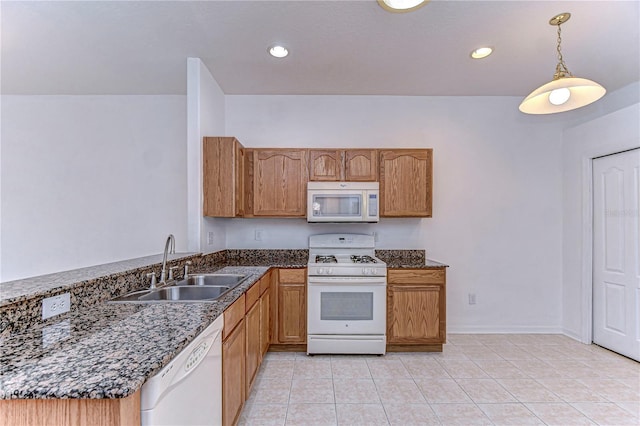 kitchen featuring pendant lighting, light tile patterned flooring, white appliances, and sink