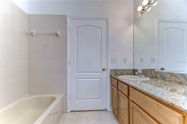 bathroom with tile patterned floors, vanity, and shower / bathtub combination