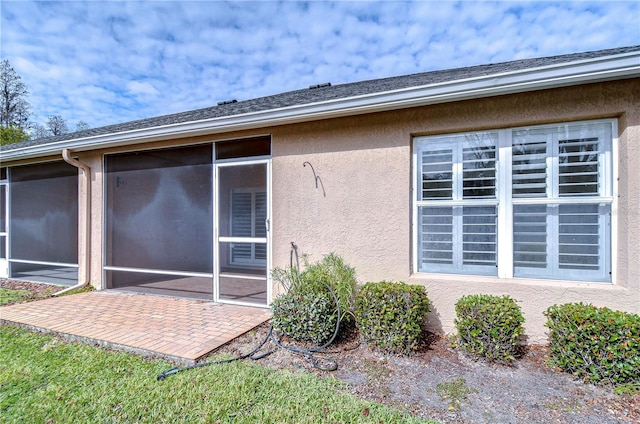 exterior space featuring a sunroom and a patio