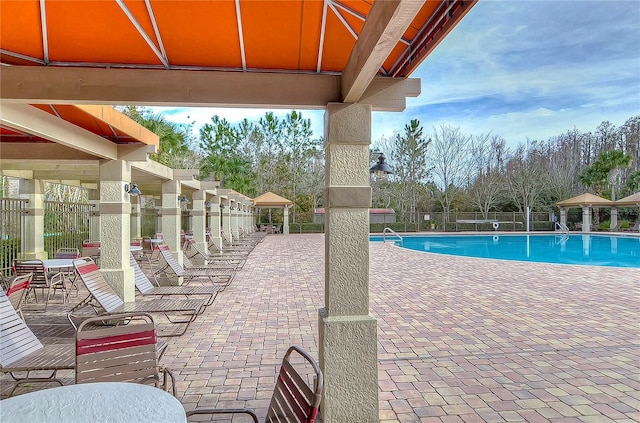 view of swimming pool featuring a patio area