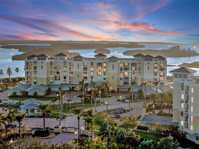 outdoor building at dusk featuring a water view