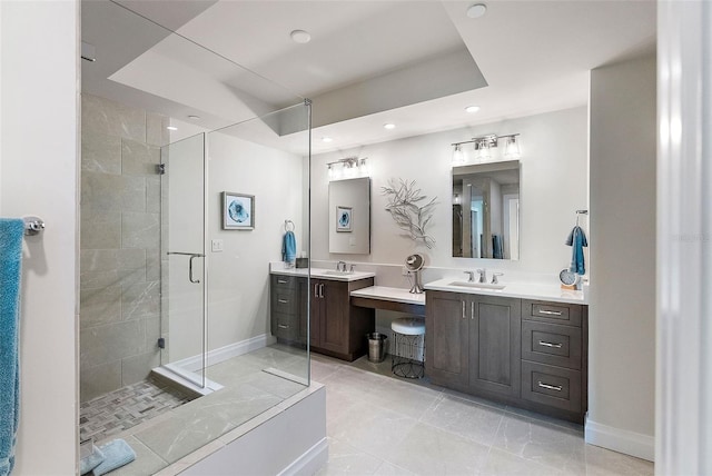 bathroom featuring vanity and a shower with door