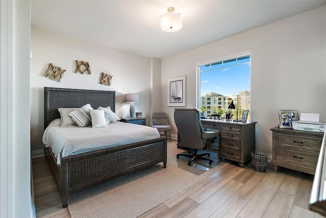 bedroom with light hardwood / wood-style floors