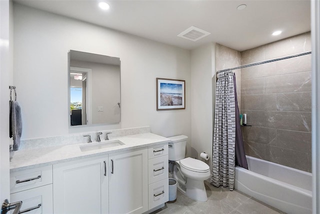 full bathroom featuring shower / tub combo with curtain, vanity, and toilet