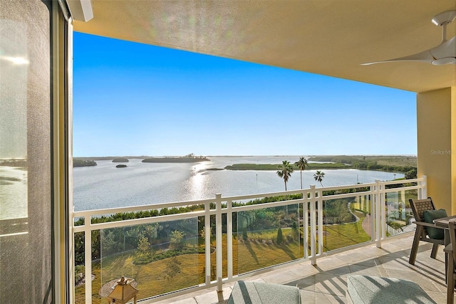 balcony featuring a water view