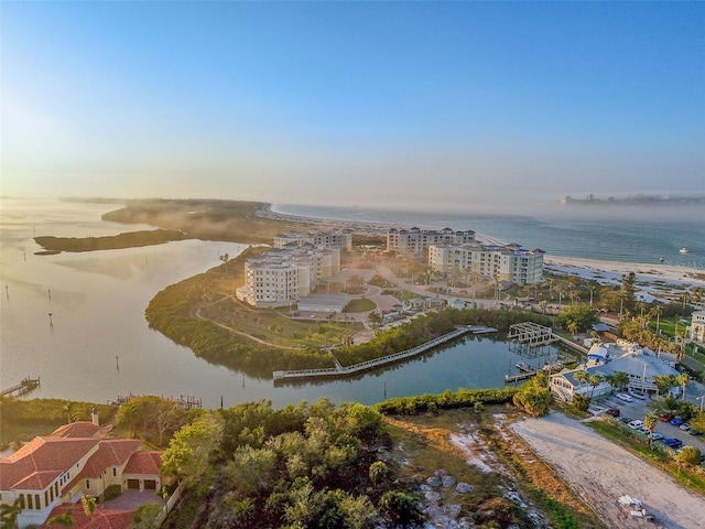 aerial view at dusk with a water view