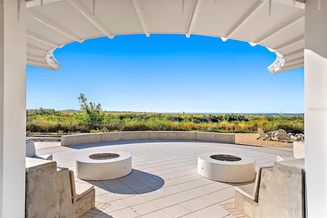 view of patio / terrace with an outdoor fire pit