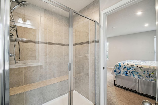 bathroom with a shower with shower door