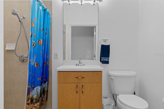 bathroom featuring vanity, toilet, and walk in shower