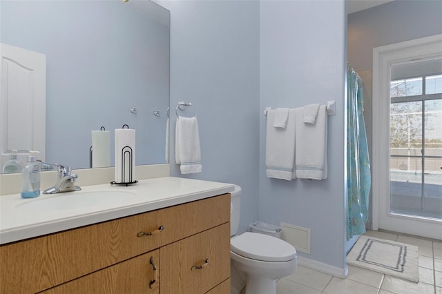 bathroom with tile patterned floors, vanity, and toilet