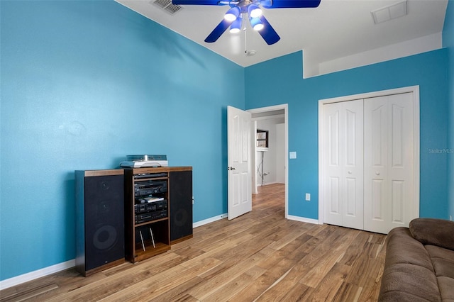 home office featuring hardwood / wood-style flooring and ceiling fan