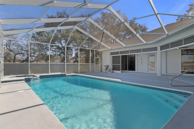 view of swimming pool with a lanai, an in ground hot tub, and a patio