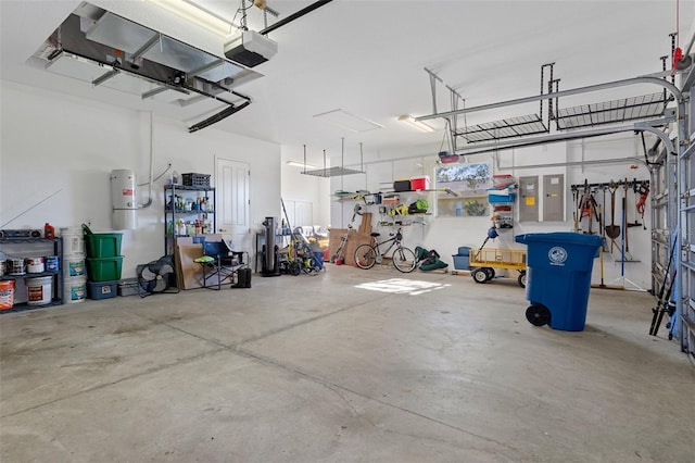 garage with electric panel and a garage door opener