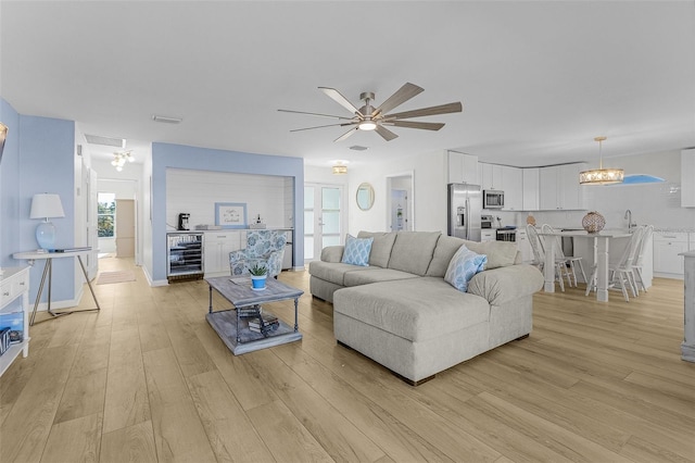 465 Lake Murex Cir, Sanibel, FL 33957 - living room with light wood-type flooring, ceiling fan, and beverage cooler