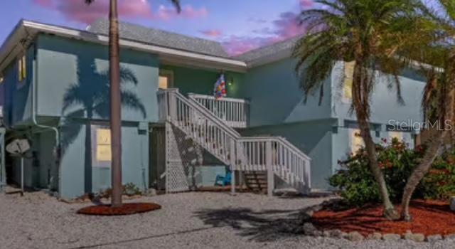 465 Lake Murex Cir, Sanibel, FL 33957 - view of back house at dusk