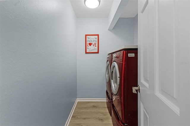 465 Lake Murex Cir, Sanibel, FL 33957 - washroom featuring light hardwood / wood-style flooring and washer and clothes dryer