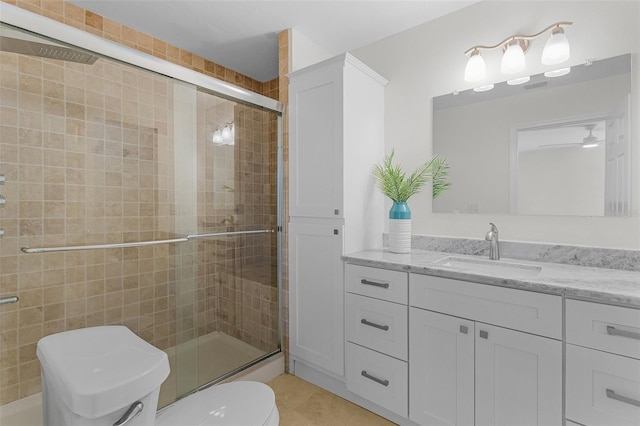 465 Lake Murex Cir, Sanibel, FL 33957 - bathroom with tile patterned floors, a shower with door, vanity, and toilet