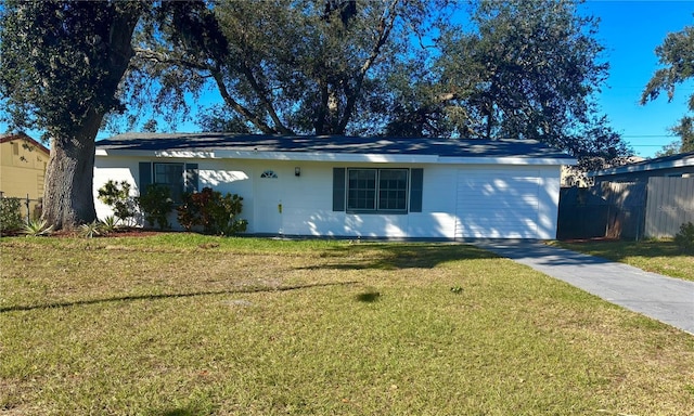 ranch-style home featuring a front yard