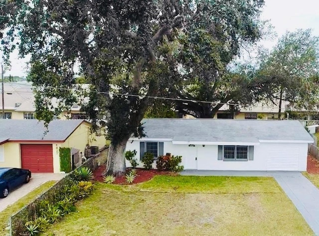 ranch-style house with a front yard and a garage