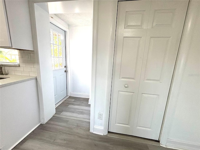 doorway to outside with light hardwood / wood-style floors