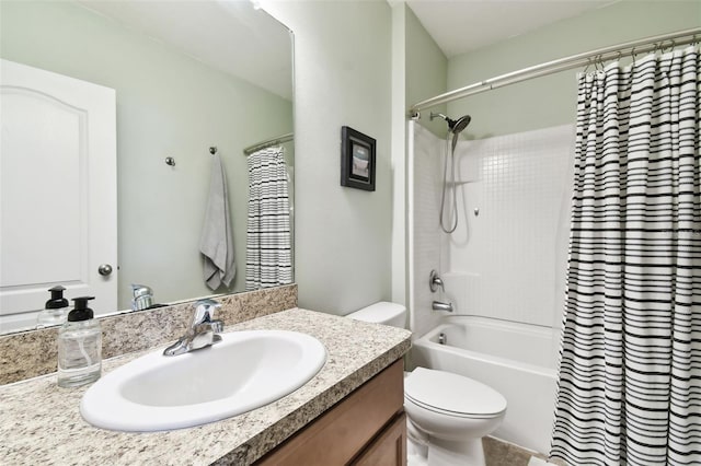 full bathroom with vanity, shower / bath combo, and toilet