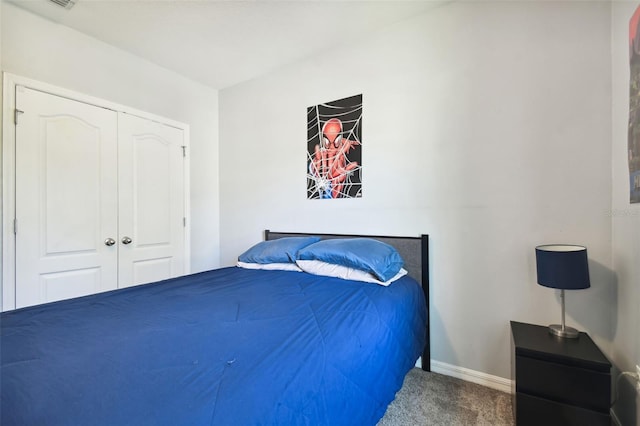 carpeted bedroom with a closet