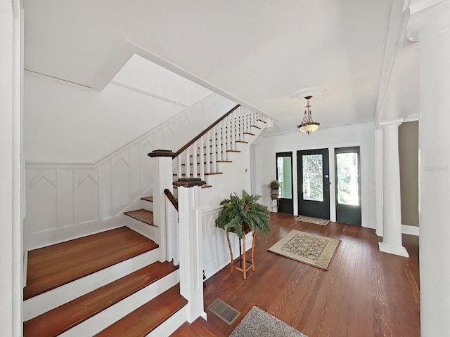 entrance foyer with dark hardwood / wood-style floors