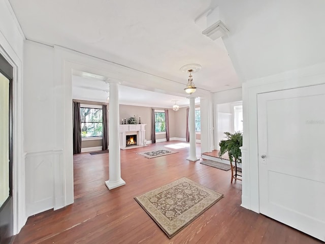 foyer with decorative columns and dark hardwood / wood-style floors